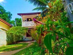 a view of a house from the garden at Niluka Rest in Kataragama