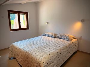 a bedroom with a bed and a window at Maison Sud entre mer et vignes in Saint-Julien les Martigues +18 photos