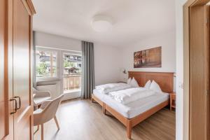 Postel nebo postele na pokoji v ubytování Hotel Oberwirt