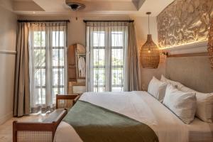 Postel nebo postele na pokoji v ubytování Hotel Casa Sonara