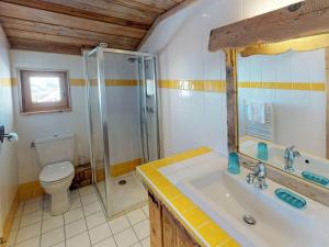 a bathroom with a shower and a sink and a toilet at Chalet de charme 14 pers. au pied des pistes avec parking, sauna et wifi - FR-1-452-108 in Les Menuires +14 photos