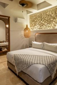 Postel nebo postele na pokoji v ubytování Hotel Casa Sonara