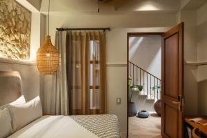 Postel nebo postele na pokoji v ubytování Hotel Casa Sonara