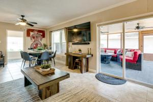 a living room with a table and a dining room at Hot Tub and Outdoor Kitchen Stylish Home in Bryan in Bryan