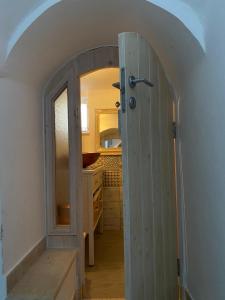 an open door to a bathroom in a house at In centro da Cinzia in Ostuni