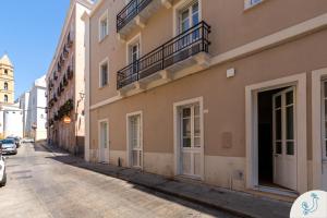 a street in a city with a building at Domus Carolina - Stylish living in the soul of Cagliari in Cagliari