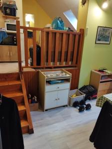 a room with a bunk bed and a staircase at studio des roses in Gournay-en-Bray