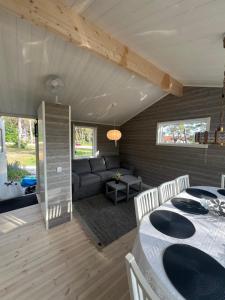 a living room with a couch and a table at Villa Lullyhill in Visby