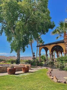 a gazebo in a park with trees and grass at Lajitas Golf Resort in Terlingua