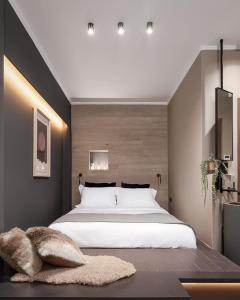 Postel nebo postele na pokoji v ubytování Ermis Suites by GM Luxury Suites Kalavryta
