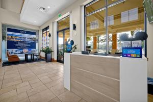 a lobby of a building with a reception desk at Regal Oaks Resort Vacation Townhomes by IDILIQ - Free Private Hot tub! in Orlando +74 photos