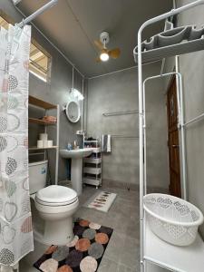 a bathroom with a toilet and a sink at 29 Palms Thailand in Ban Klang