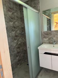 a bathroom with a shower and a sink at Ali's House 61 in Anayurt +15 photos