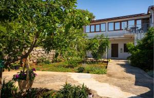 a house with a tree in front of it at 3 Bedroom Gorgeous Apartment In Seline in Seline +32 photos