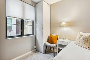 En eller flere senge i et værelse på Central Apartment for 3