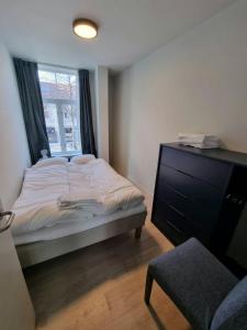 En eller flere senge i et værelse på Central Apartment for 4