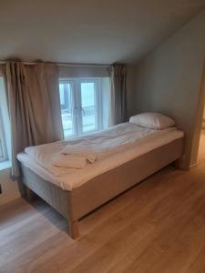 En eller flere senge i et værelse på Central Apartment for 5