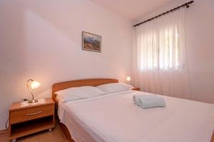 Postel nebo postele na pokoji v ubytování Apartments Zora