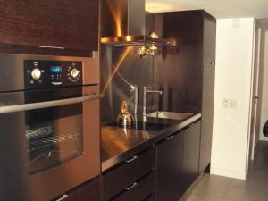 A cozinha ou cozinha compacta de Yoo Punta del Este - Rental Club Apartments