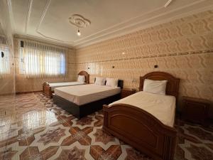 Postel nebo postele na pokoji v ubytování Appartements dior al hoceima