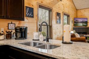 a kitchen counter with a sink in a cabin at New Build Hot Tub Fireplace in Pigeon Forge