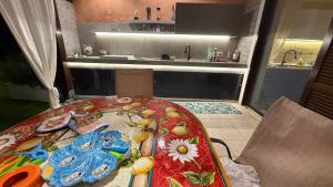 a kitchen with a table with plates on it at Luxury Villa Diamante in Casa del Lago