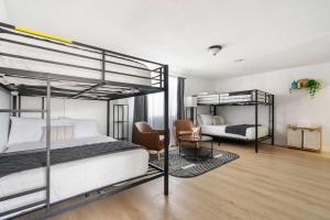 a bedroom with two bunk beds and a living room at Family Pool House with games in National City +34 photos