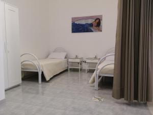 Posteľ alebo postele v izbe v ubytovaní B&B Il Tramontano
