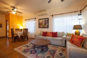 a living room with a couch and a table at Casa de los Geckos in La Paz +27 photos