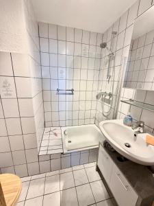 Koupelna v ubytování Küstenbude Deichbude + 10 fotografií