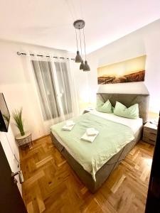 Postel nebo postele na pokoji v ubytování MonteRelax Apartments Becici
