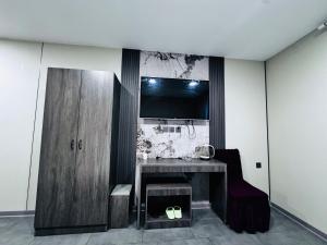 A cozinha ou kitchenette de Lofty Hotel