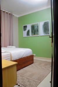 Voodi või voodid majutusasutuse White Cottage Suites toas