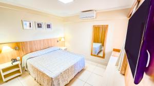 Cama ou camas em um quarto em diRoma Piazza direto com o Grupo diRoma com acesso ao Acqua Park e Café da manhã