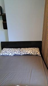 a small bed in a room with at Studio Flat in London