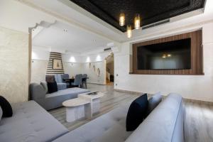 Posezení v ubytování 4 Bed Villa lagune River Palm Marrakech with Pool