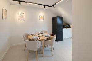 a dining room with a table and chairs at Martinović apartman in Zaprešić