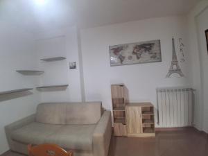 a living room with a couch and a table at Onda Blu in Marina di Vasto