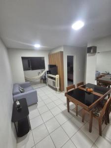 Χώρος καθιστικού στο Apartamento aconchegante e bem localizado