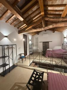 a room with a bed and a wooden ceiling at Il Fienile di Bisarno in Pontassieve