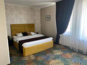 Postel nebo postele na pokoji v ubytování Coquette VILLA Mamaia Nord