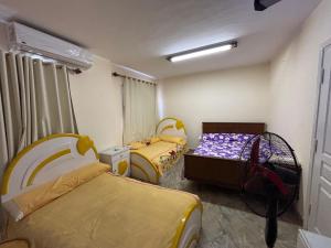 Ένα ή περισσότερα κρεβάτια σε δωμάτιο στο Luxury Twin Villa in El Ain El Sokhna