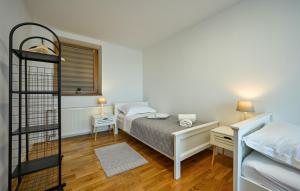 a bedroom with a bed and two bunk beds at Villa Panorama Hill by Villas Guide in Cestica