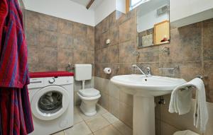 a bathroom with a washing machine and a sink at Villa Panorama Hill by Villas Guide in Cestica +14 photos