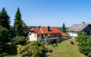 a house with a red roof on a green yard at Villa Panorama Hill by Villas Guide in Cestica