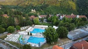 an aerial view of a resort with two swimming pools at Vila Dunjić Prolom Banja in Prolomska Banja