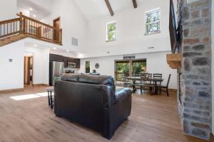 a living room with a couch and a table at Peaceful Timbers Getaway in Hollister +37 photos