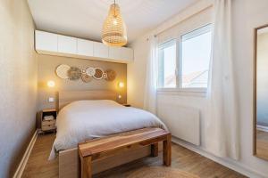 Llit o llits en una habitació de Coeur de l'eau