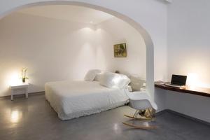 Llit o llits en una habitació de Hacienda Na Xamena, Ibiza