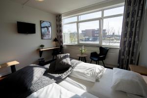 Voodi või voodid majutusasutuse Hotel Medi toas
